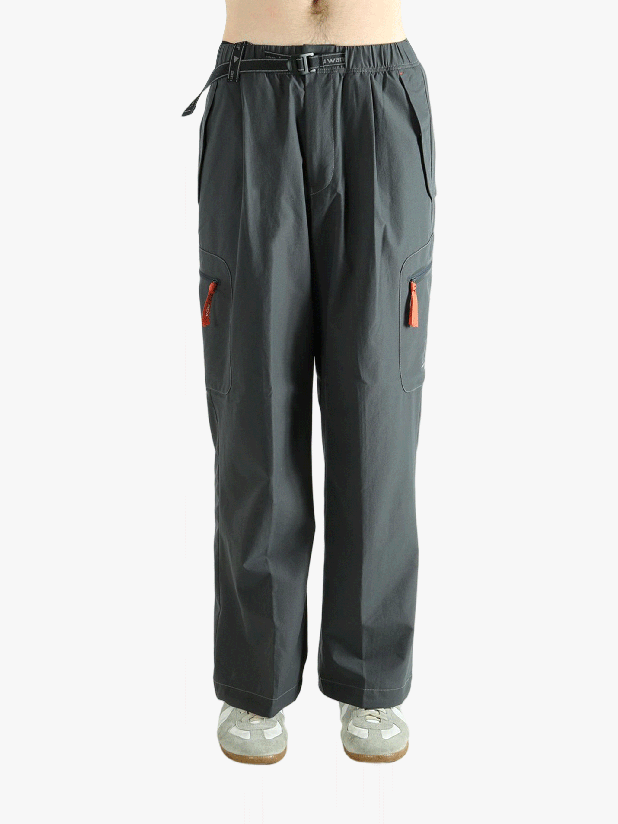 Black pants worn by a person, showing the pants's fit