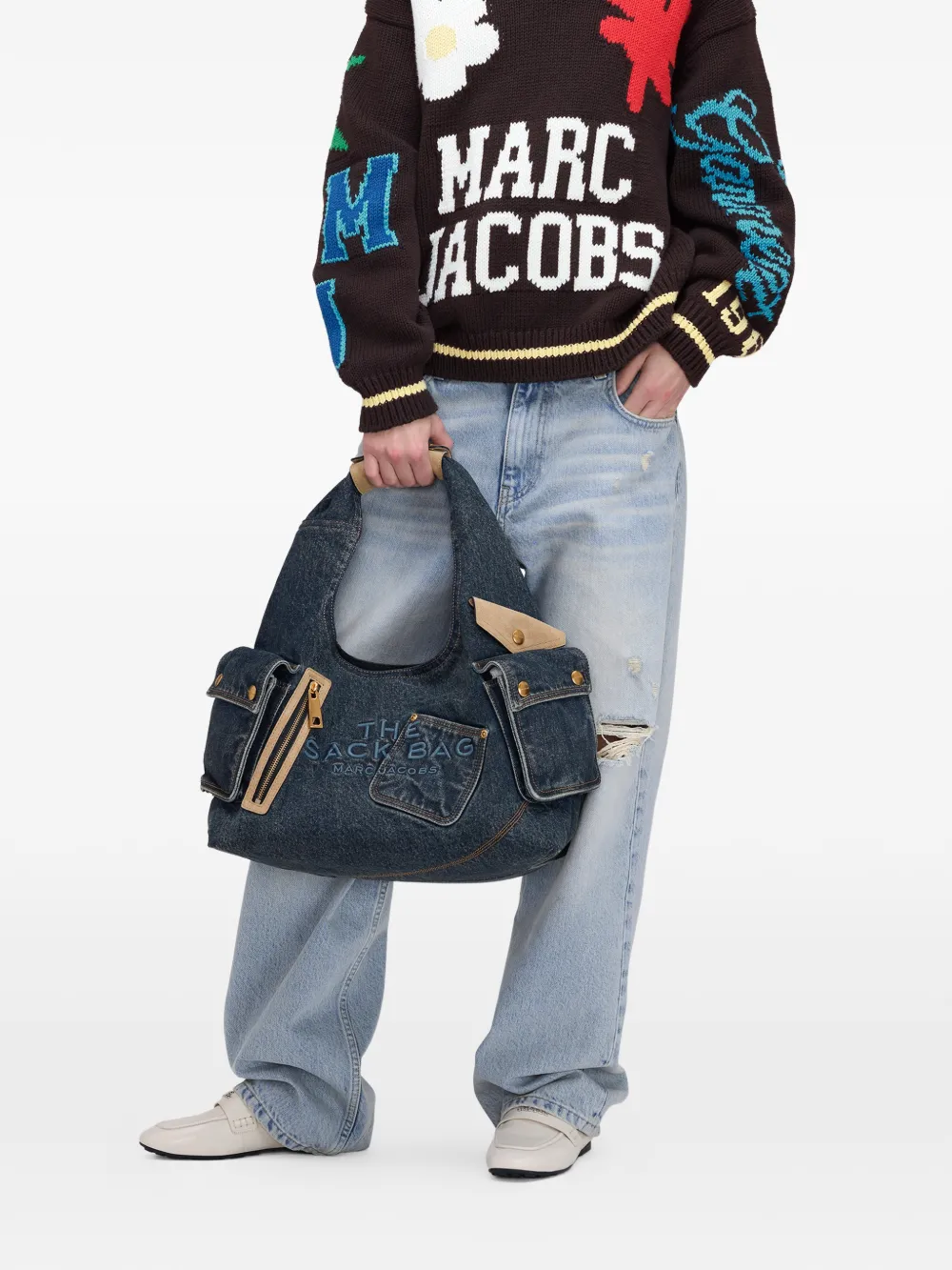 blue bags worn by a person, showing the bags fit