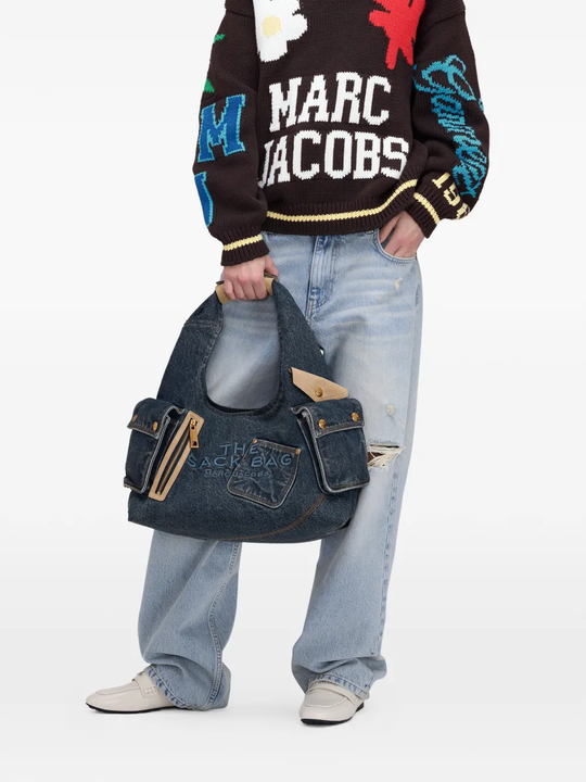 blue bags worn by a person, showing the bags fit