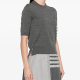 Grey t-shirts worn by a person, showing the t-shirts fit