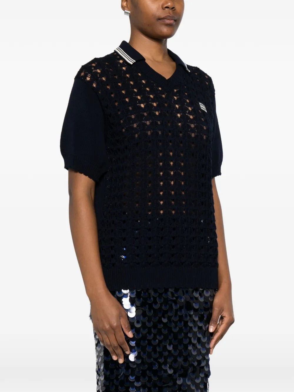 Blue shirts worn by a person, showing the shirts fit