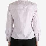 Pink shirt worn by a person, showing the shirt's fit