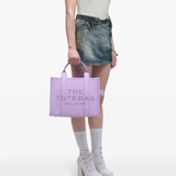 Purple bag worn by a person, showing the bag's fit