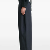 Navy pants worn by a person, showing the pants fit