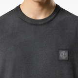 Close up of the black t-shirt, showing texture of the cotton fabric