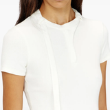 Close up of white top, showing texture of the cotton fabric