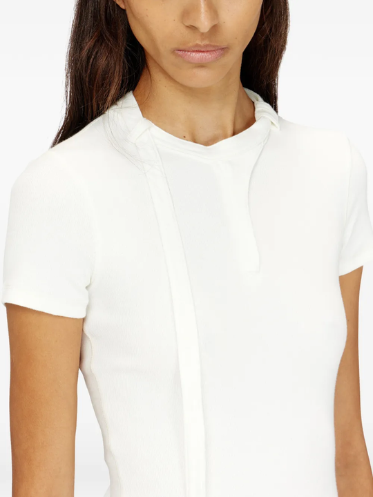 Close up of white top, showing texture of the cotton fabric