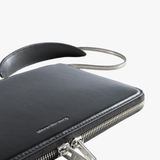 Close up of the black bag, showing texture of the leather fabric