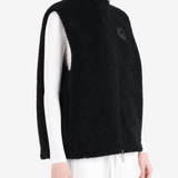 Black top worn by a person, showing the top fit