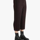 Brown pants worn by a person, showing the pants's fit