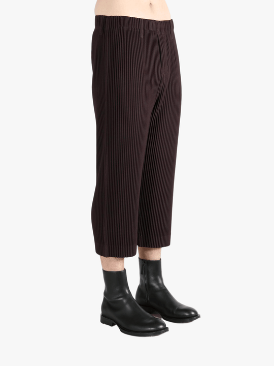 Brown pants worn by a person, showing the pants's fit