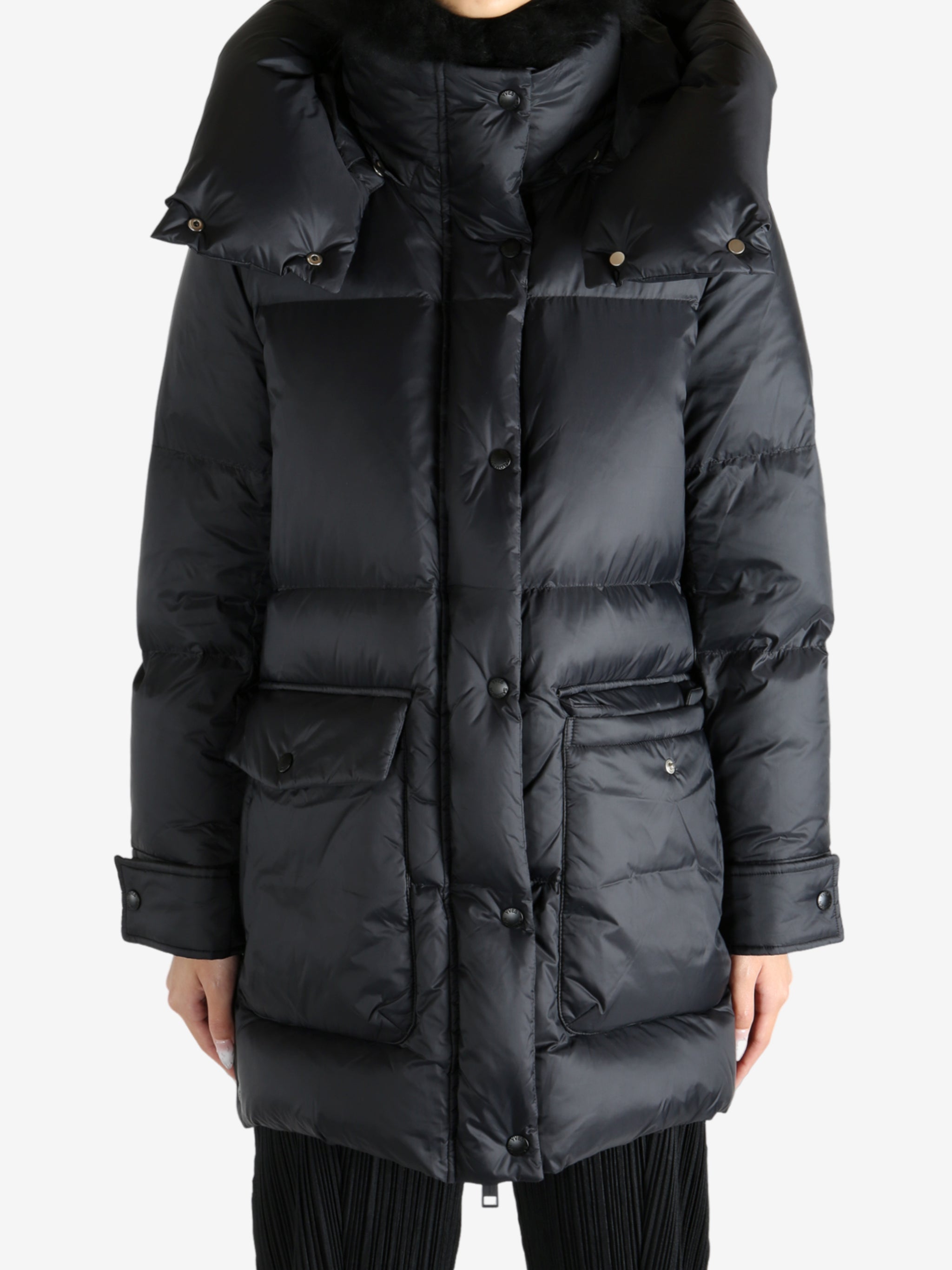 Black jacket worn by a person, showing the jacket's fit