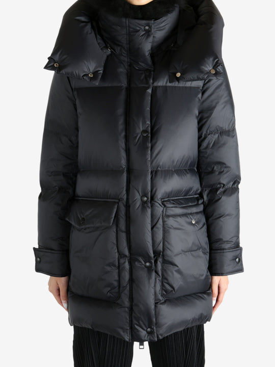 Black jacket worn by a person, showing the jacket's fit