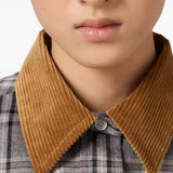 Close up of grey shirts, showing texture of the cotton fabric