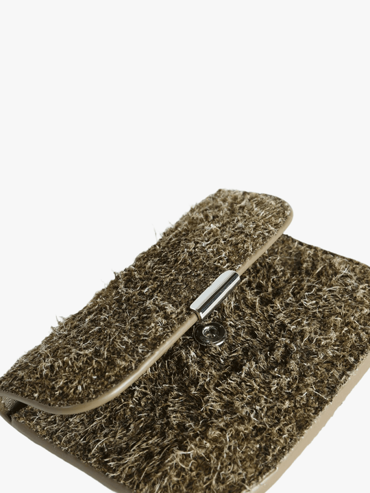 Close up of green wallet, showing texture of the VA fabirc