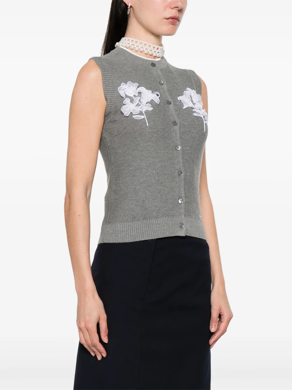 Grey cardigan worn by a person, showing the cardigan's fit