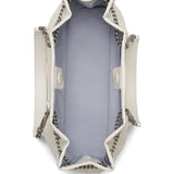 Close up of the white bag, showing texture of the leather fabric