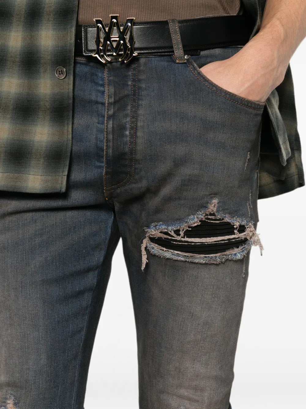 Grey jeans worn by a person, showing the jeans fit
