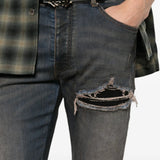 Grey jeans worn by a person, showing the jeans fit