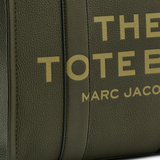 Close up of green bags,showing texture of the leather fabric.