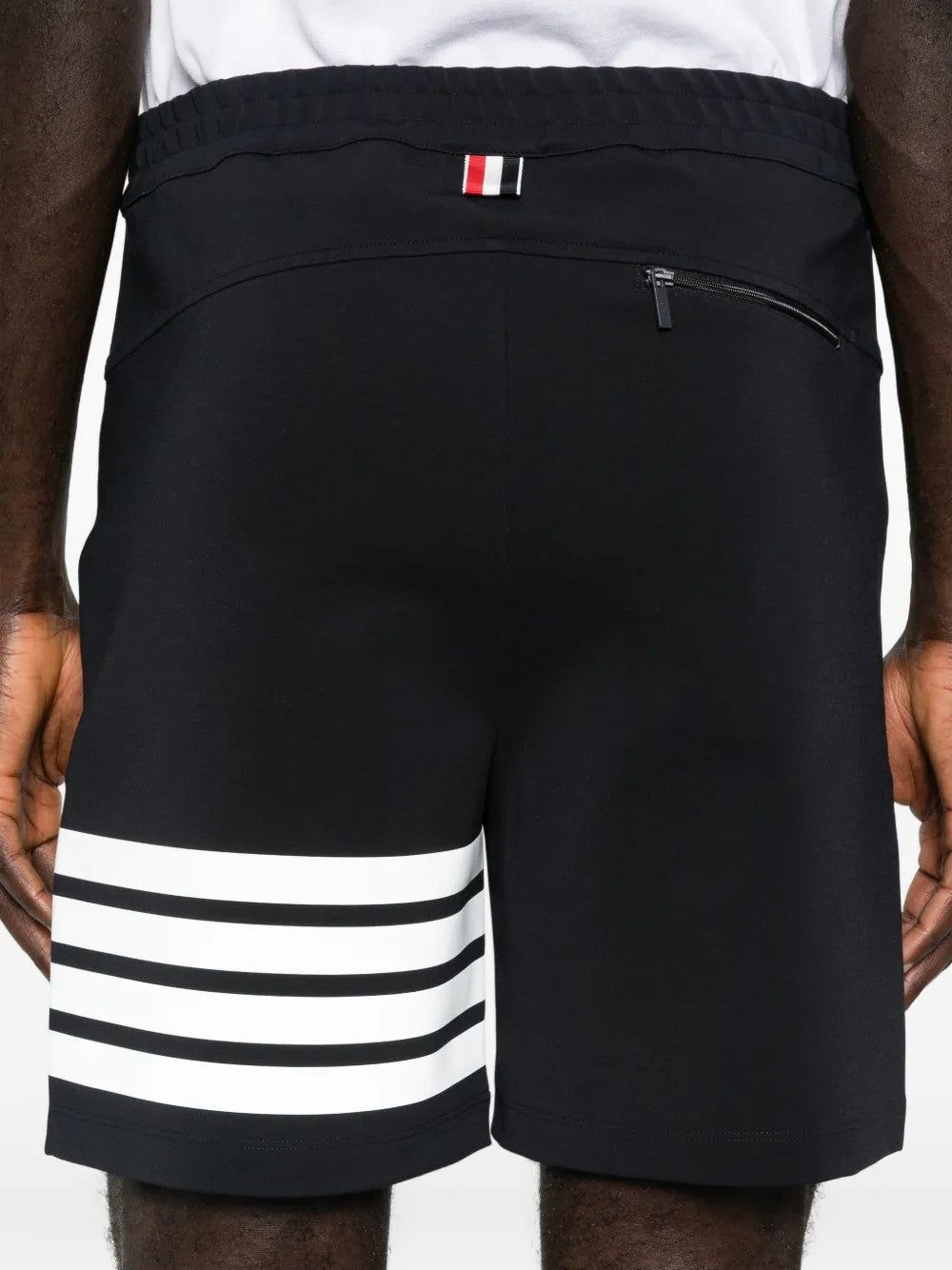 Navy shorts worn by a person, showing the shorts fit