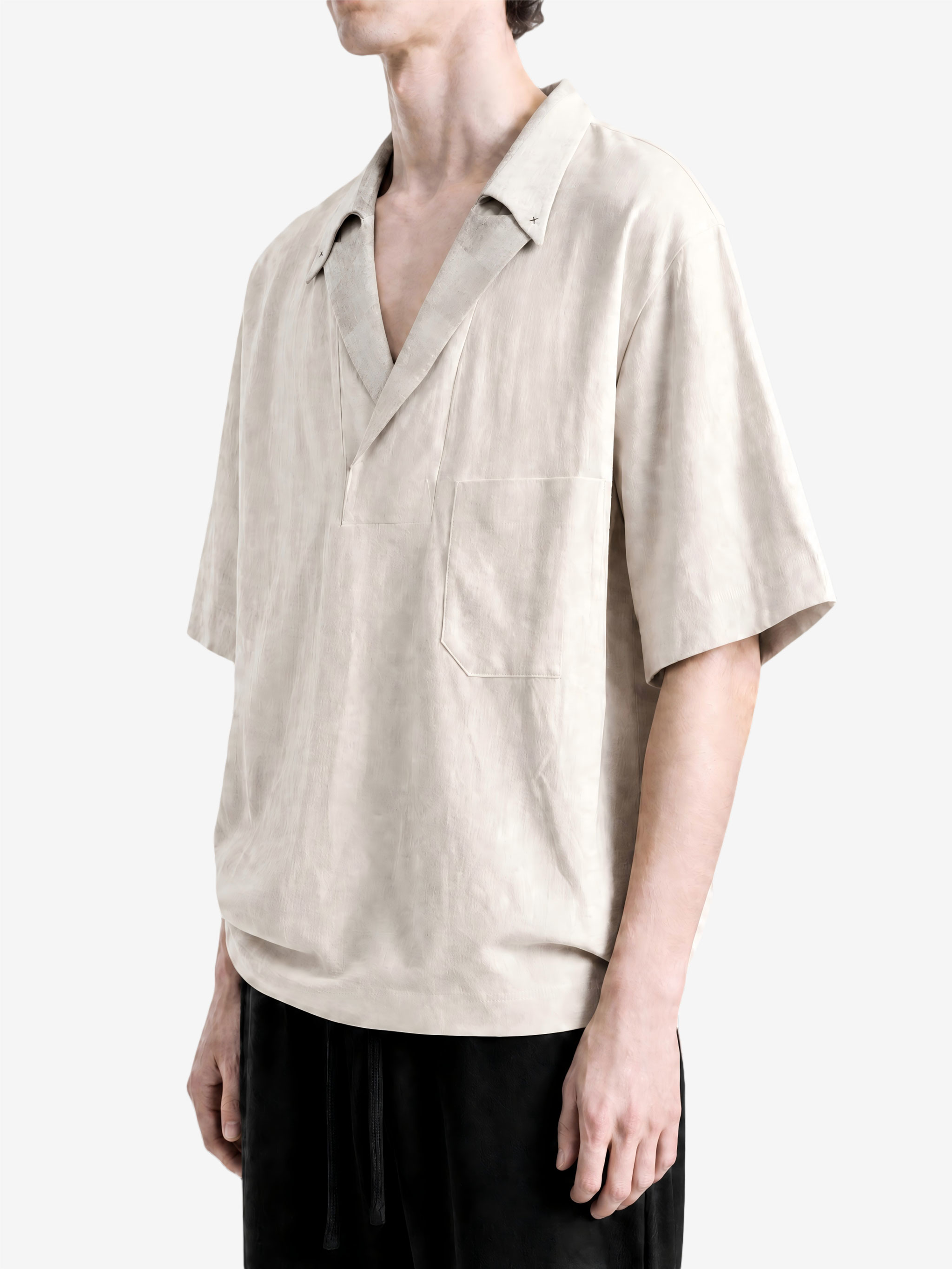 Tan t-shirt worn by a person, showing the t-shirt fit