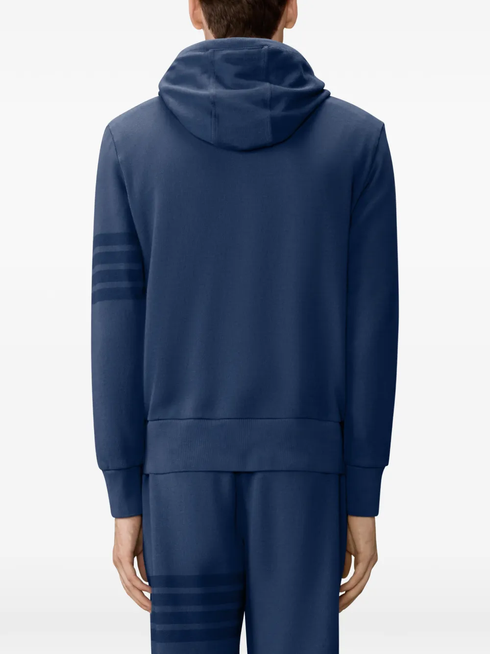 navy hoodie worn by a person, showing the hoodie fit