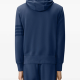 navy hoodie worn by a person, showing the hoodie fit