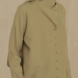 Green shirt worn by a person, showing the shirt fit