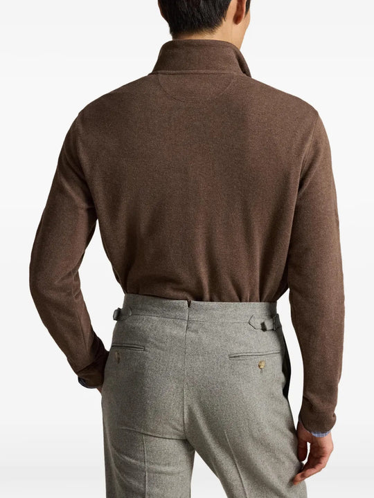 Brown knitwear worn by a person, showing the knitwear fit