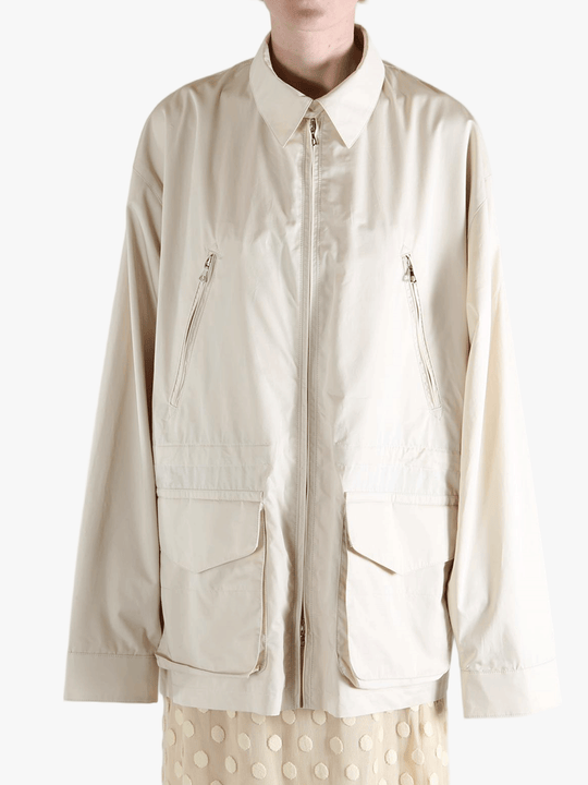 White jacket worn by a person, showing the jacket's fit