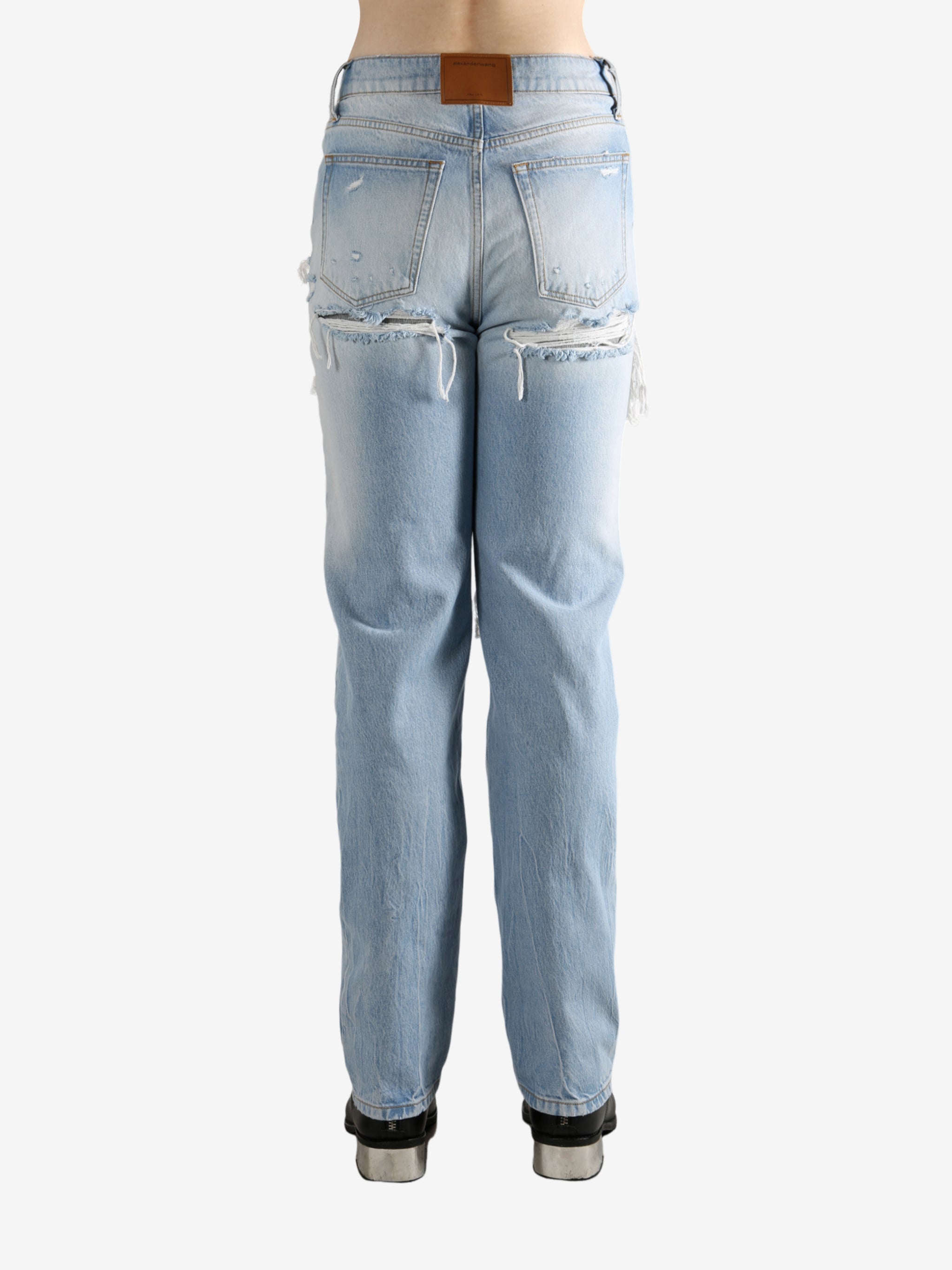 Blue jeans worn by a person, showing the jeans fit