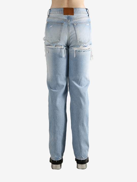 Blue jeans worn by a person, showing the jeans fit