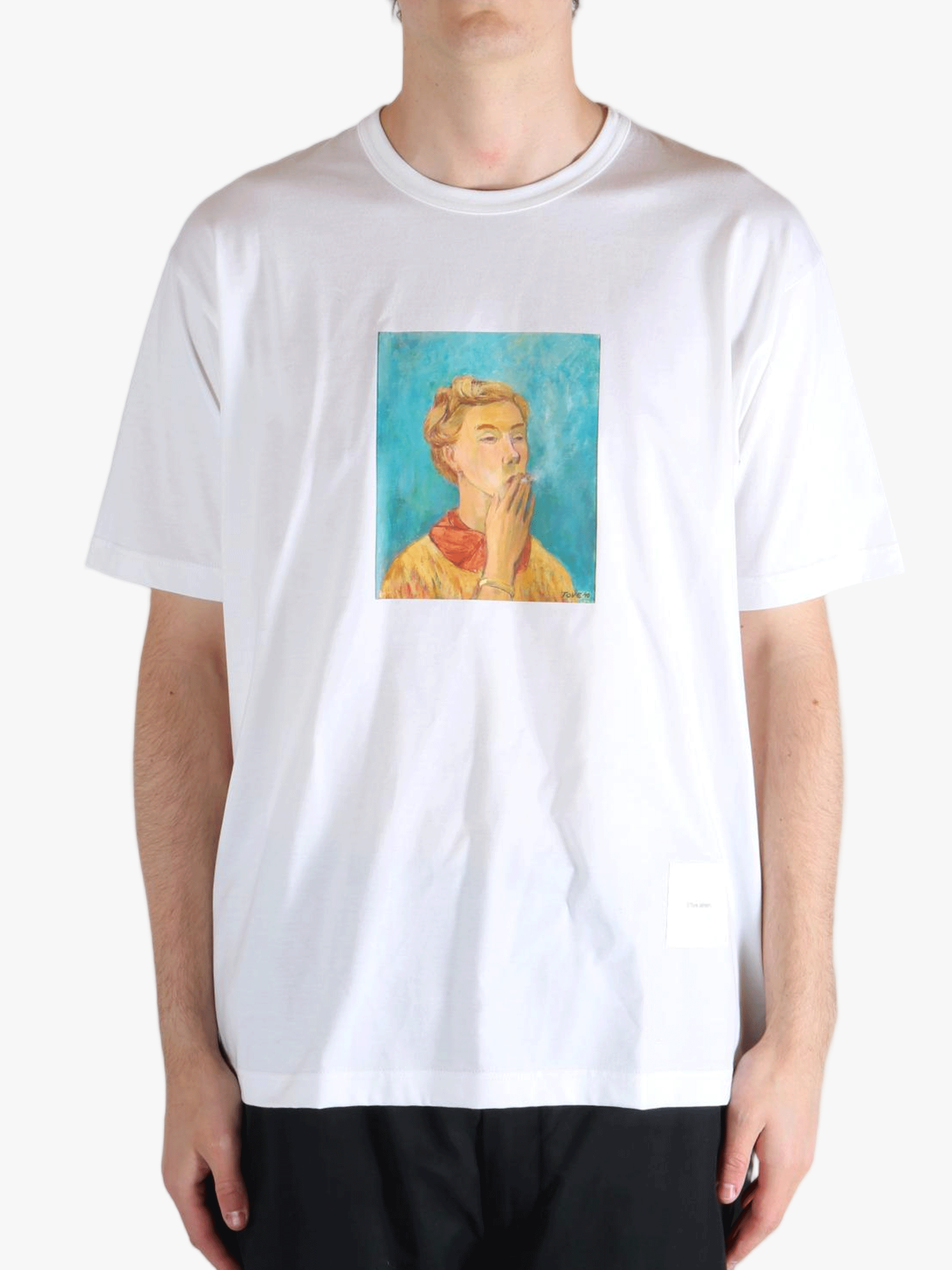 White t-shirt worn by a person, showing the t-shirt's fit