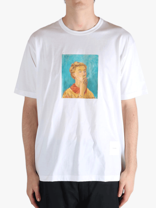 White t-shirt worn by a person, showing the t-shirt's fit