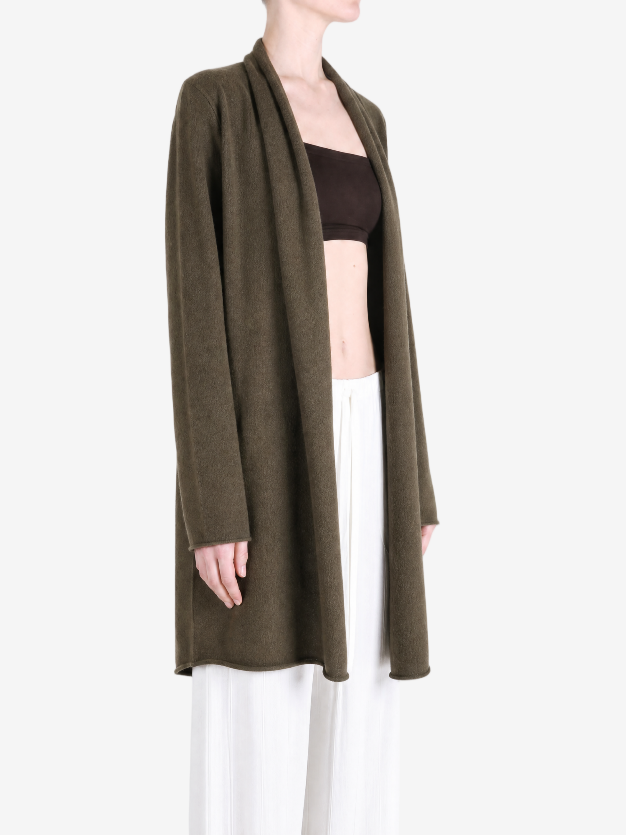 Brown knitwear worn by a person, showing the knitwear fit
