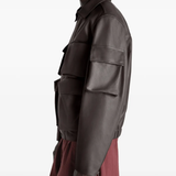 Brown coats worn by a person, showing the coats fit