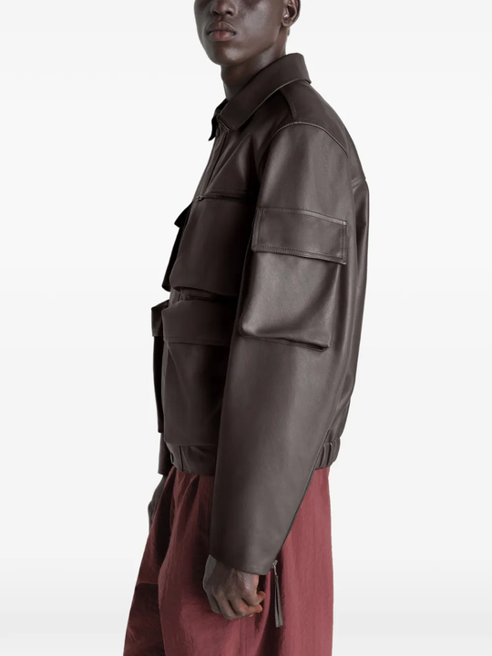 Brown coats worn by a person, showing the coats fit