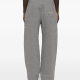 Grey pants worn by a person, showing the pants fit