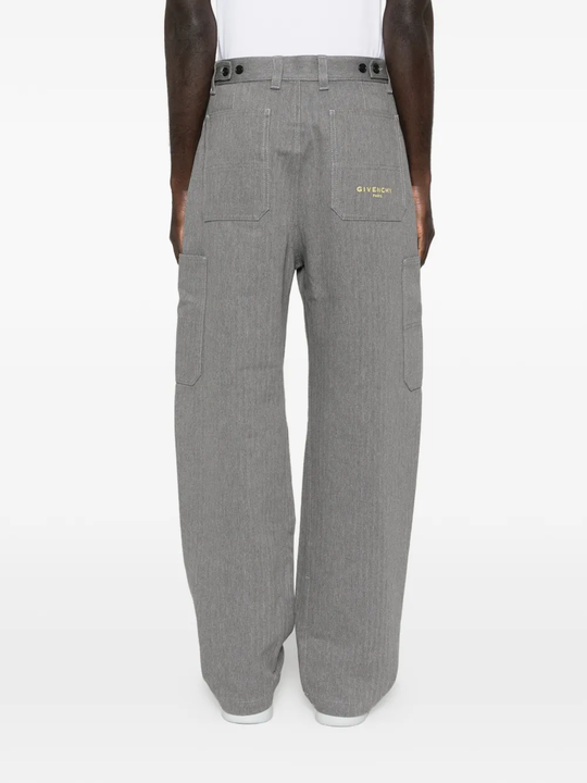 Grey pants worn by a person, showing the pants fit