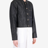 Black jacket worn by a person, showing the jacket fit