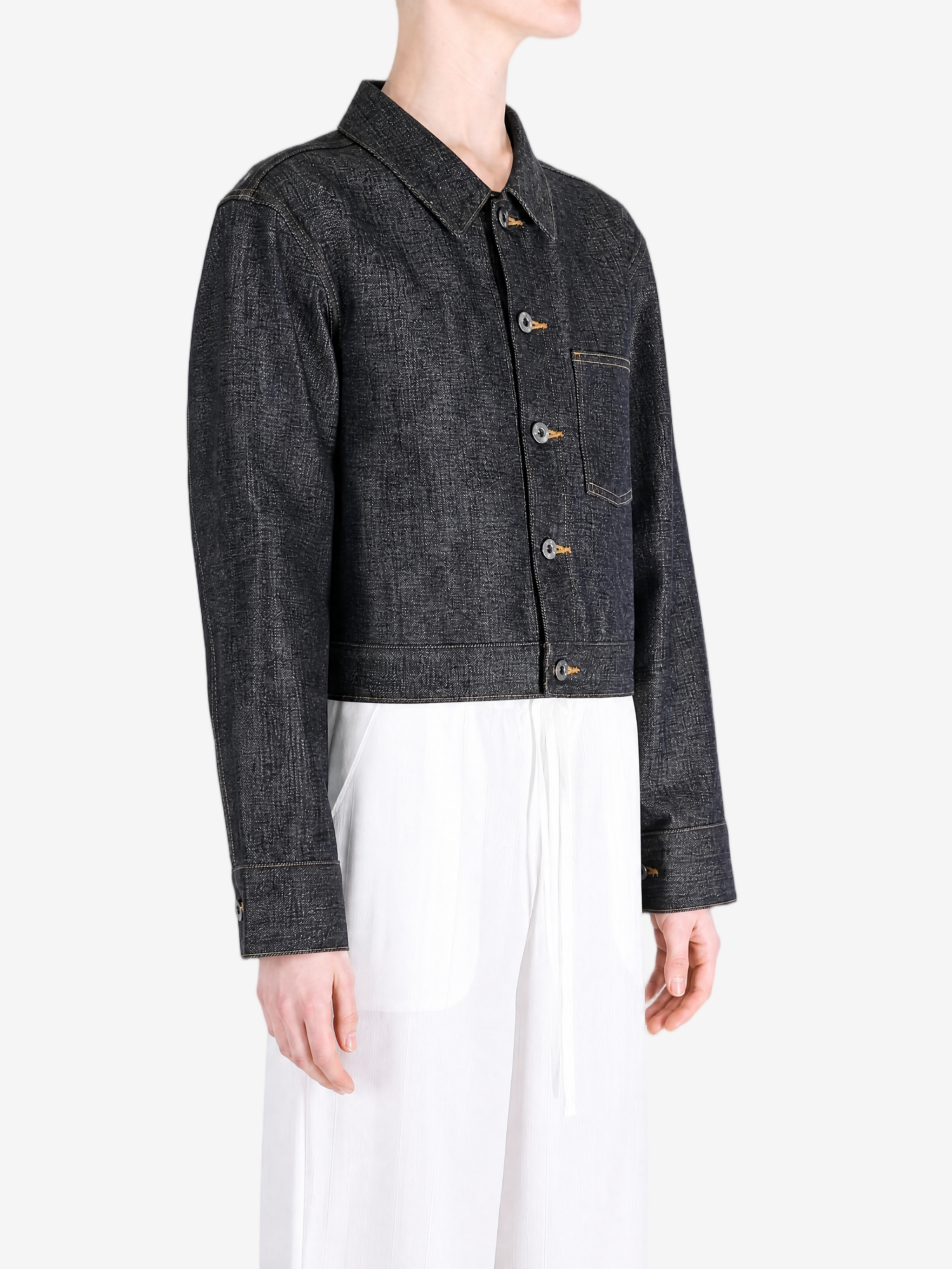 Black jacket worn by a person, showing the jacket fit