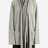 Grey knitwear worn by a person, showing the knitwear fit