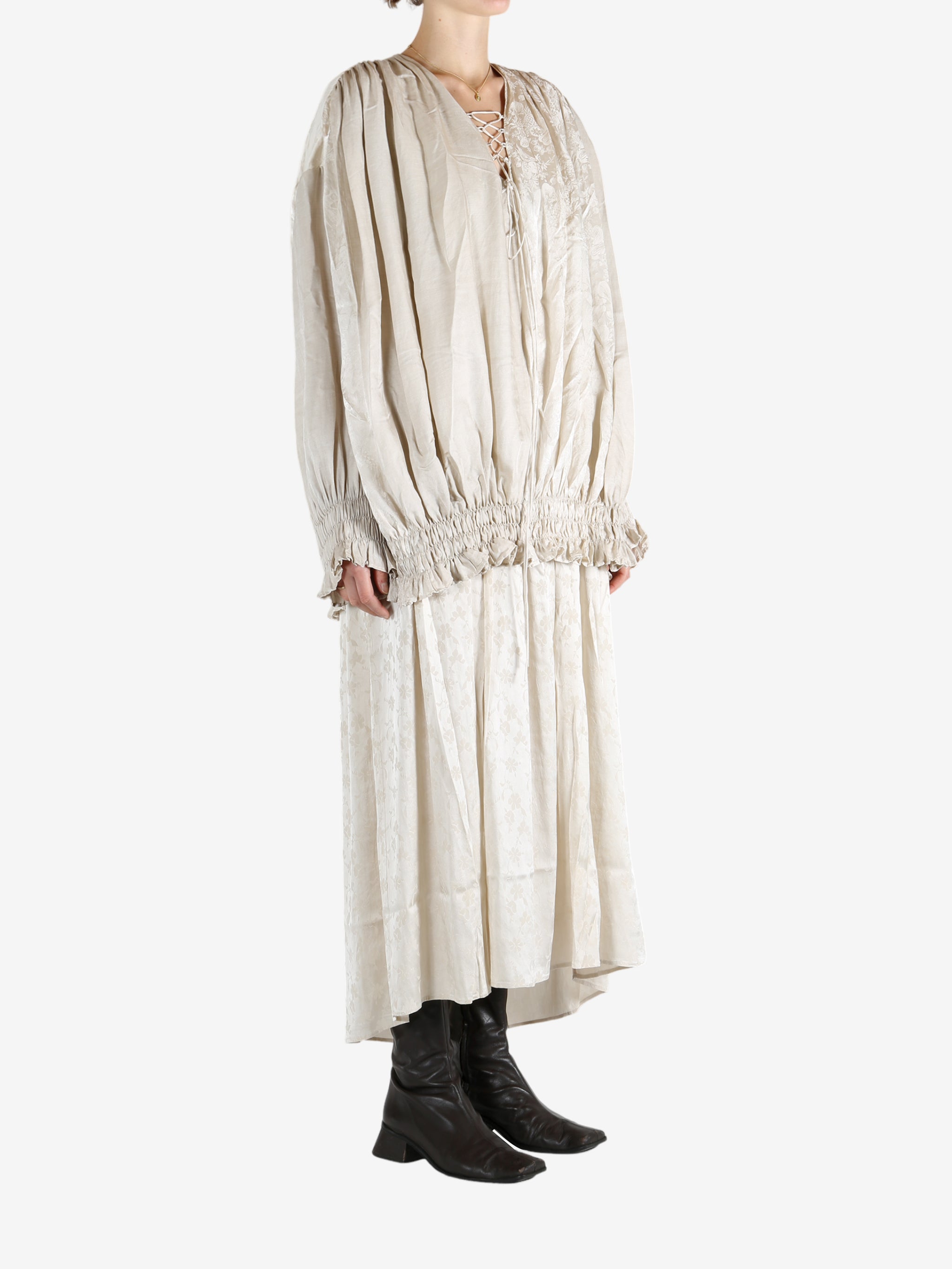 White dress worn by a person, showing the dress's fit