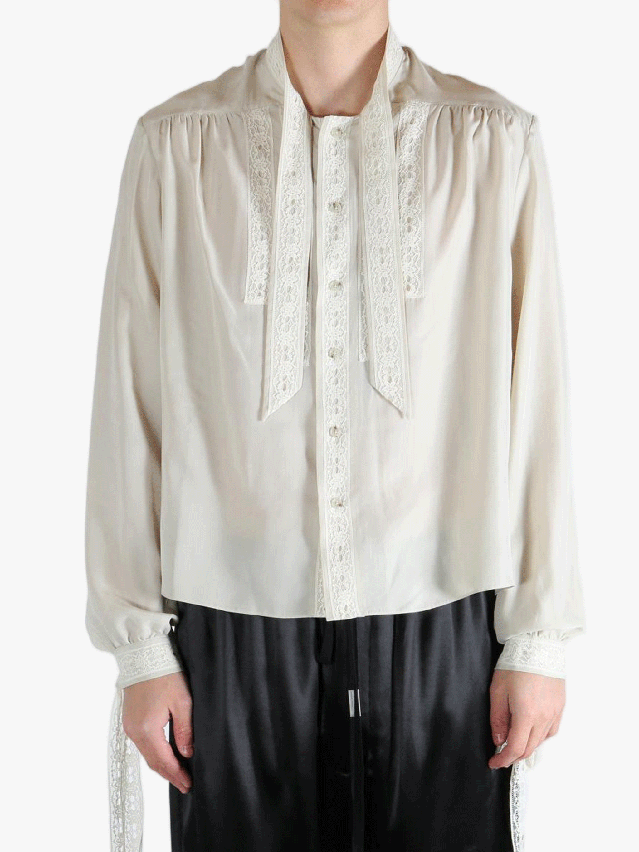 White shirt worn by a person, showing the shirt's fit