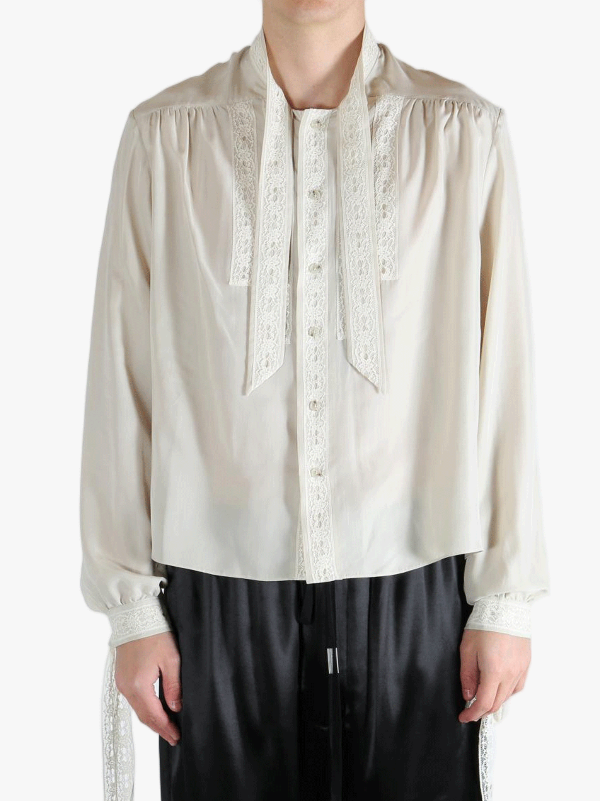 White shirt worn by a person, showing the shirt's fit