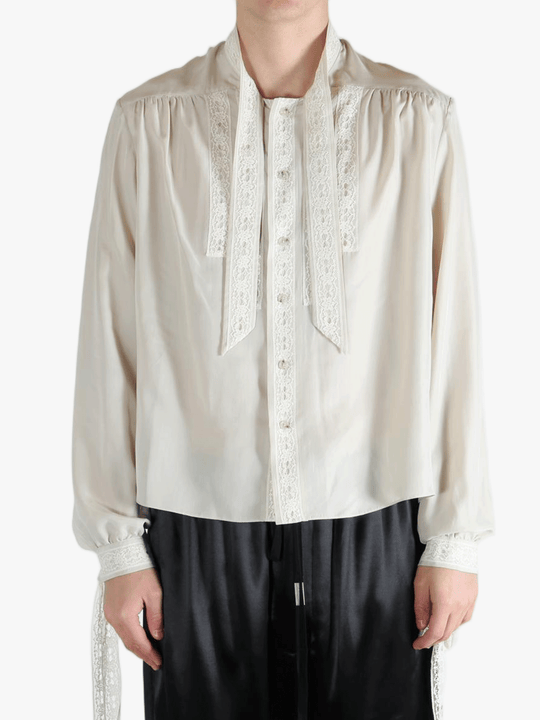 White shirt worn by a person, showing the shirt's fit