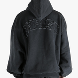 Black hoodie worn by a person, showing the hoodie fit