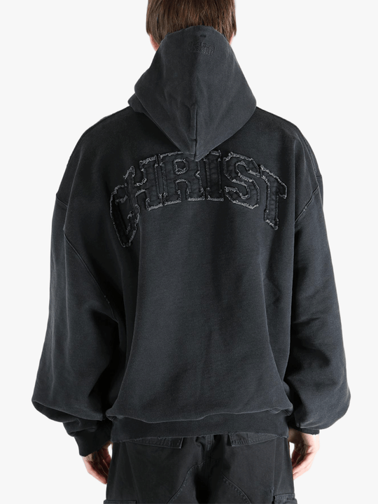 Black hoodie worn by a person, showing the hoodie fit