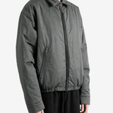 Grey jacket worn by a person, showing the jacket fit